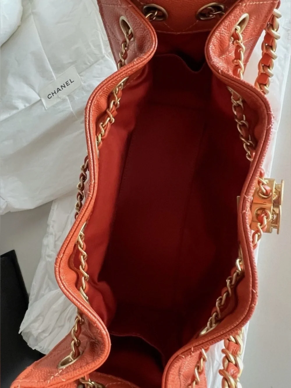 CHANEL Orange Quilted Drawstring Shoulder Bag with Gold Chain